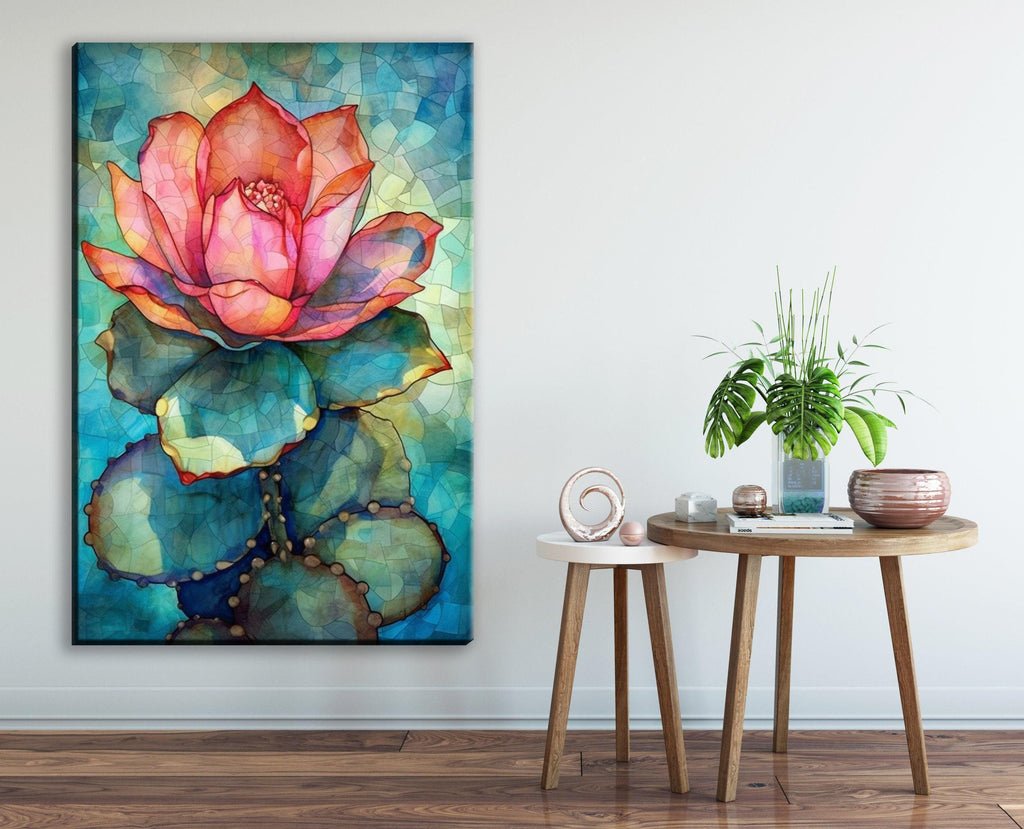 a large, colorful painting of a cactus flower on the wall, with a small round table and a potted plant in the foreground.