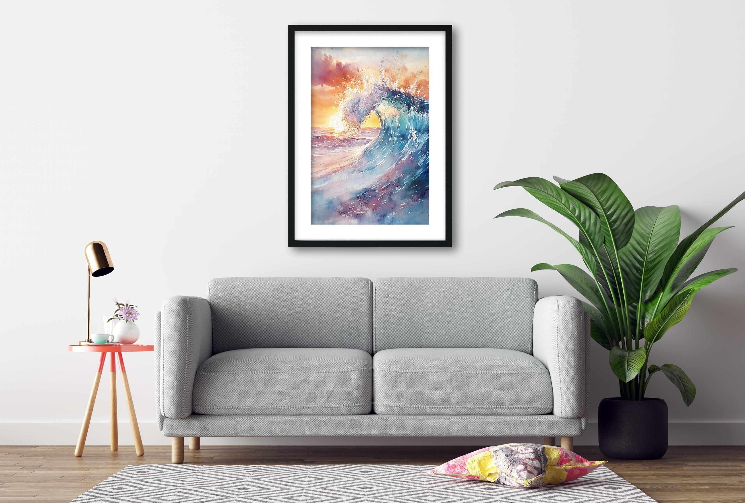 a gray sofa, a framed painting of a colorful ocean wave, a small table with a lamp, and a potted plant, all arranged in a cozy living room setting.