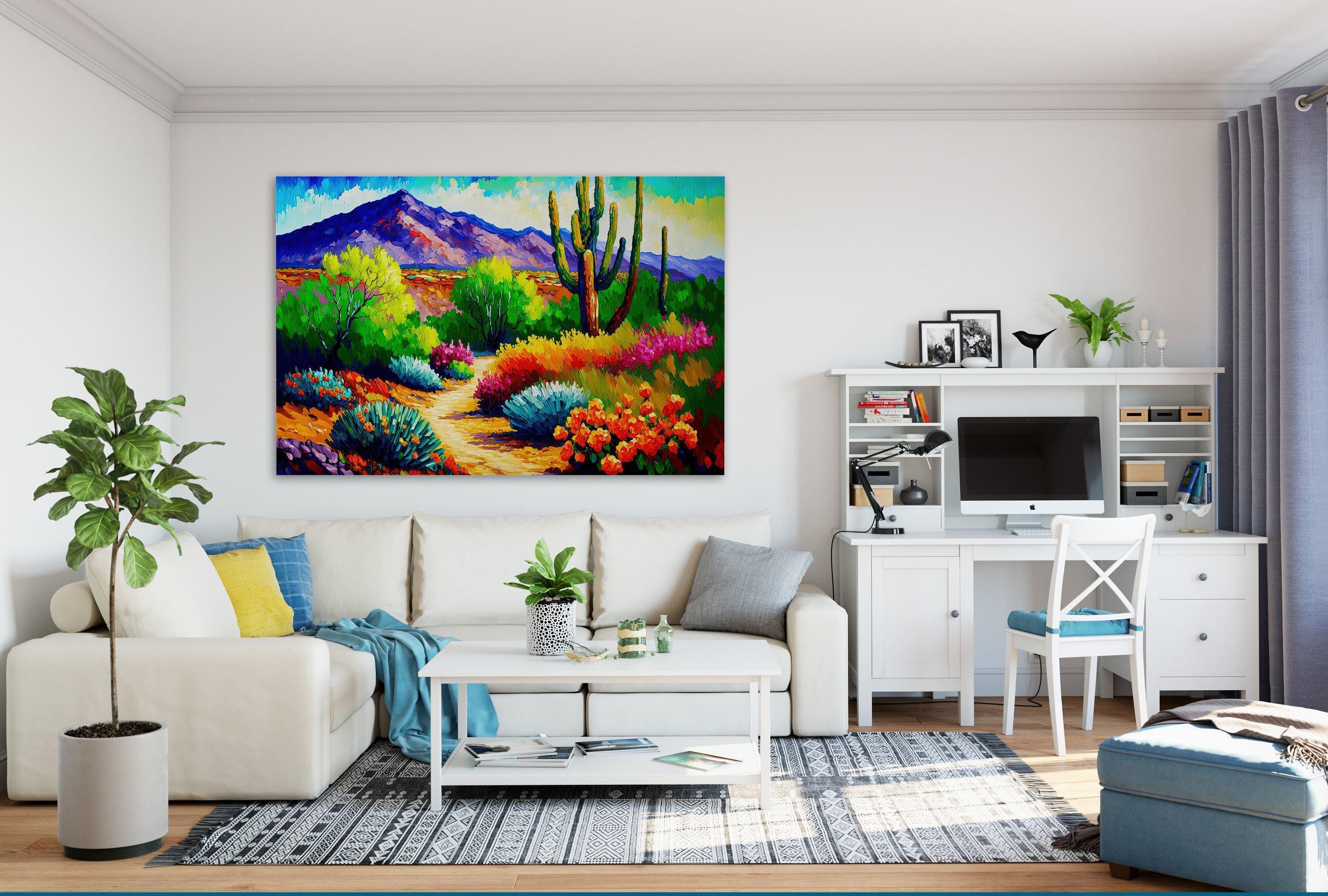 a modern living room with a large, colorful painting of a desert landscape hanging on the wall. The room is furnished with a white sofa, a coffee table, and a desk with a computer setup. The room also features various decorative elements such as potted plants, vases, and books.