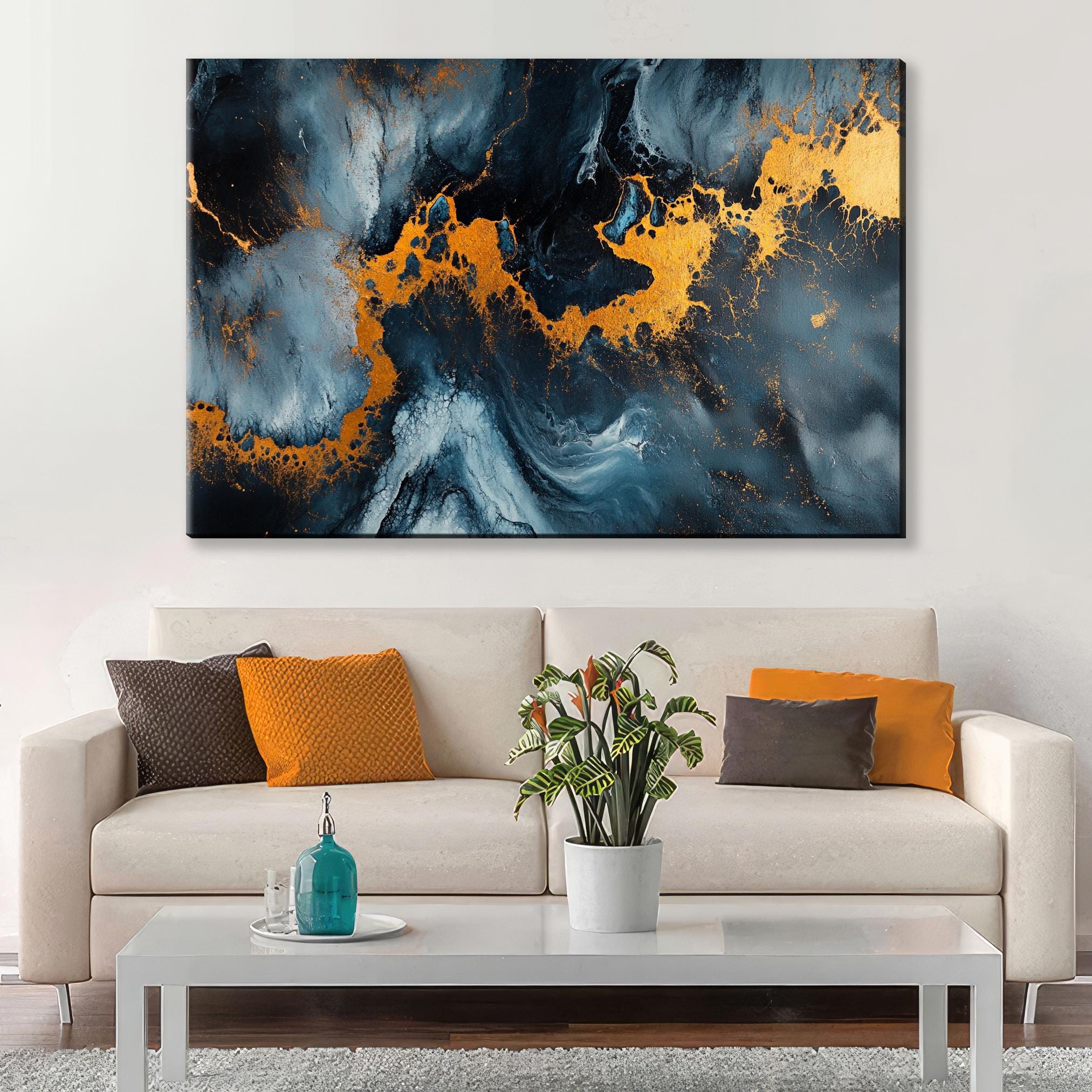 a living room with a couch and a painting on the wall