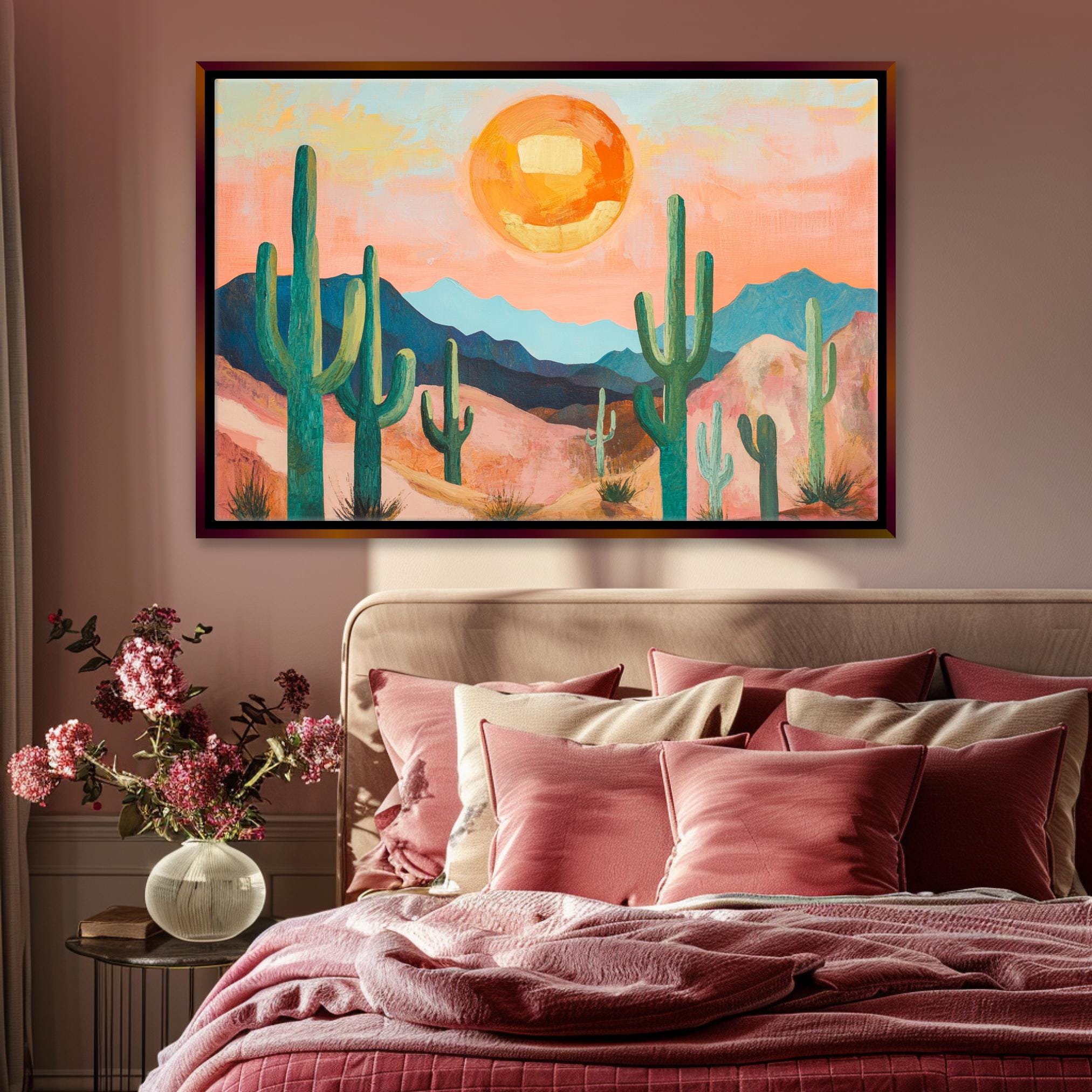 a painting of a desert scene hangs above a bed
