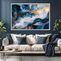 a living room with a couch and a painting on the wall