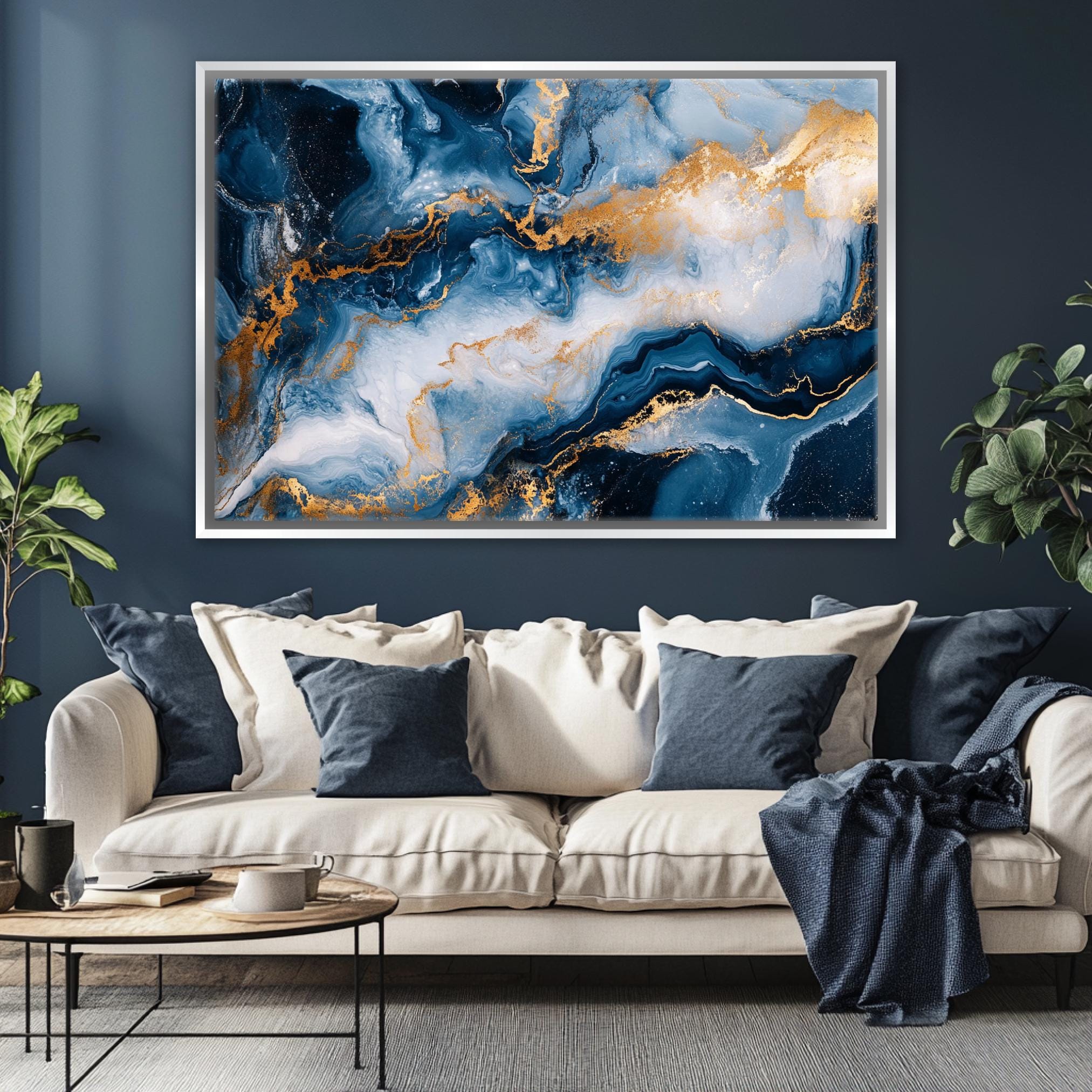 a living room with a couch and a painting on the wall