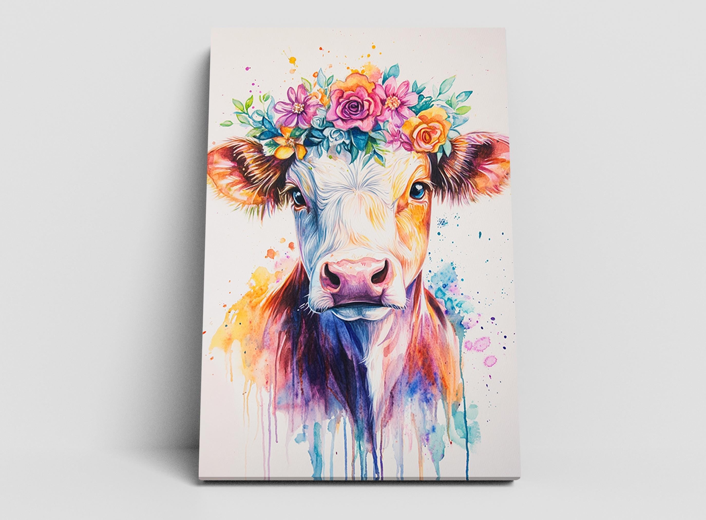 A colorful painting of a cow wearing a flower crown, with vibrant watercolor splashes and flowers surrounding the cow's face.