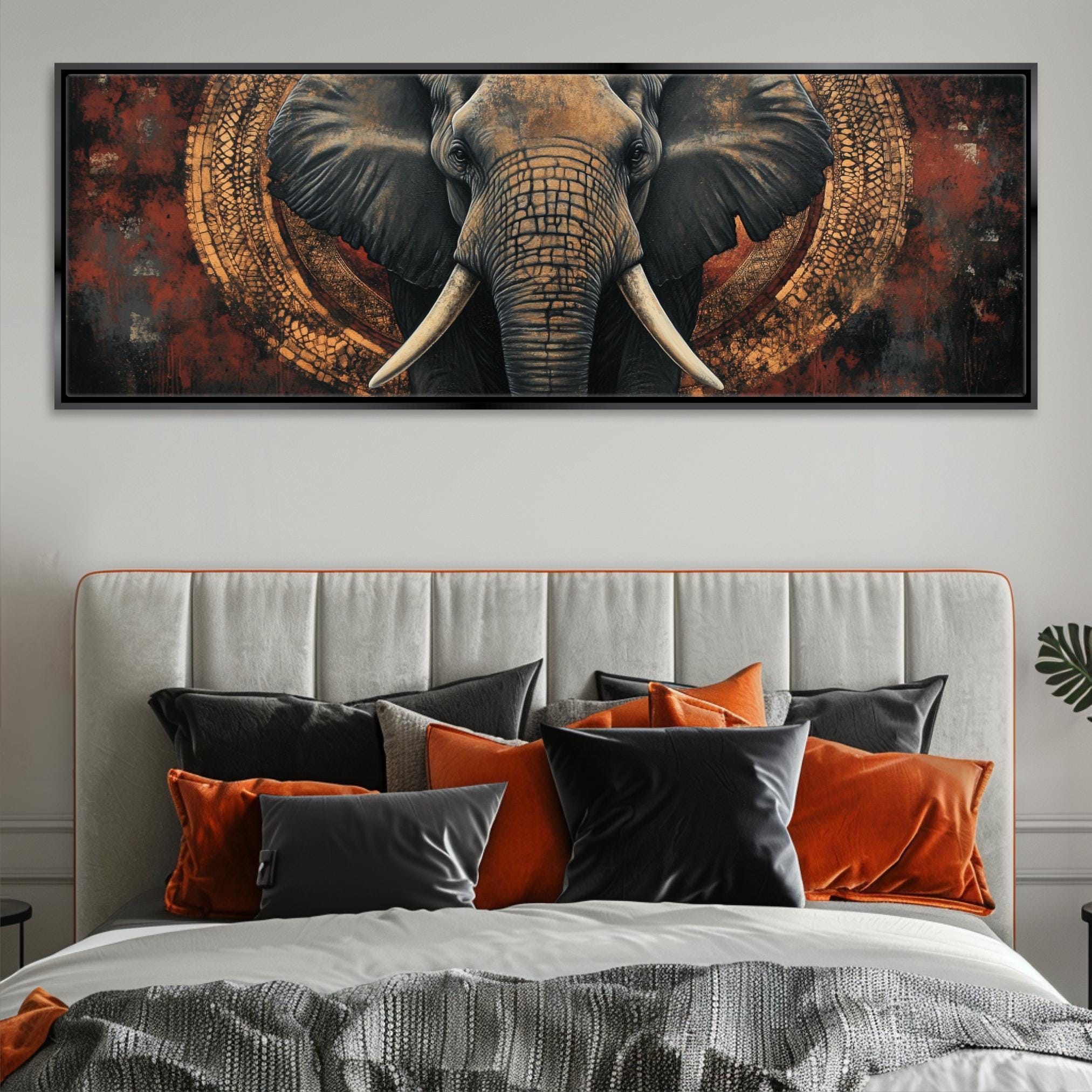 a large elephant with large tusks on a bed
