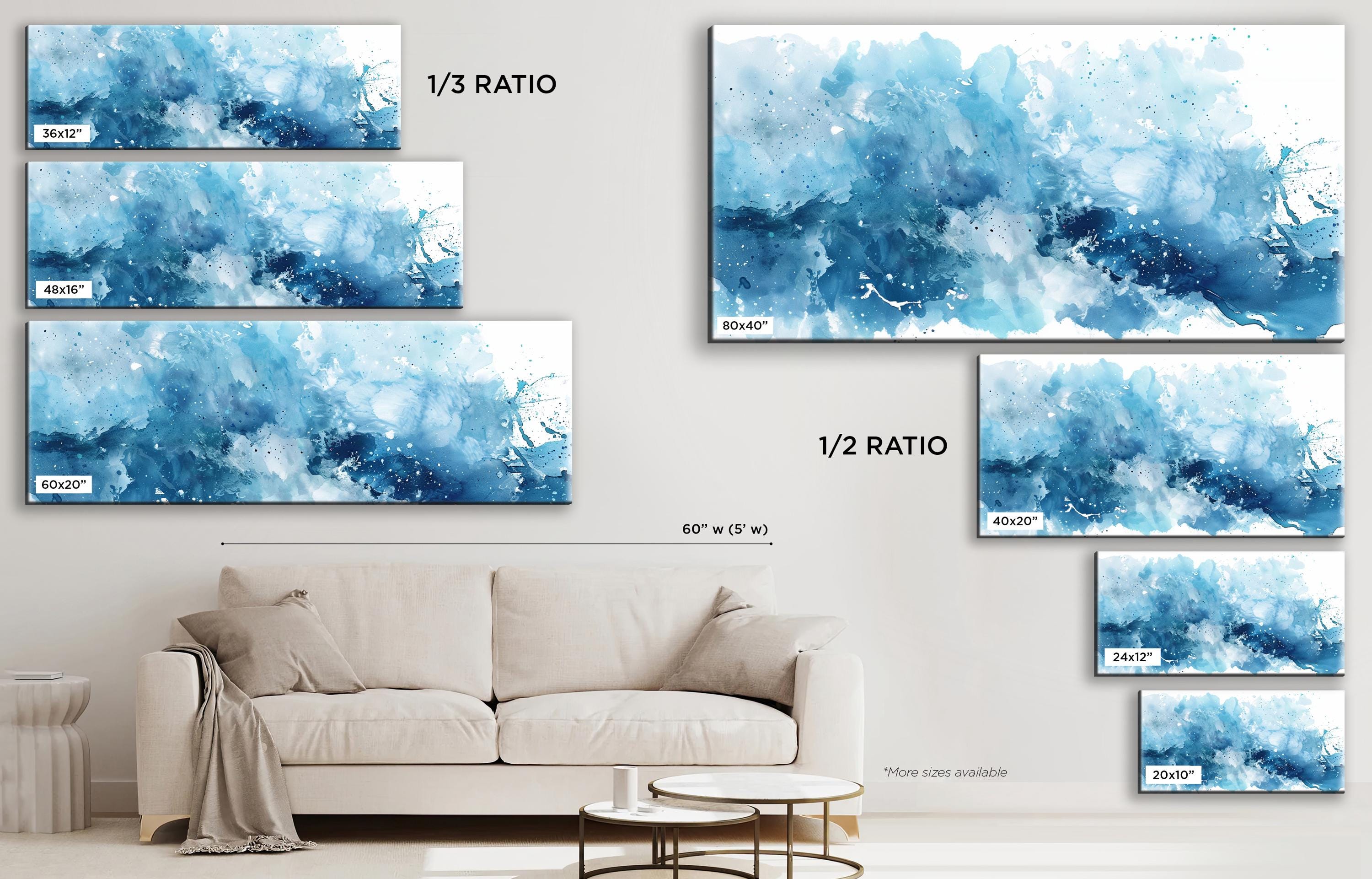 a living room with a couch and paintings on the wall