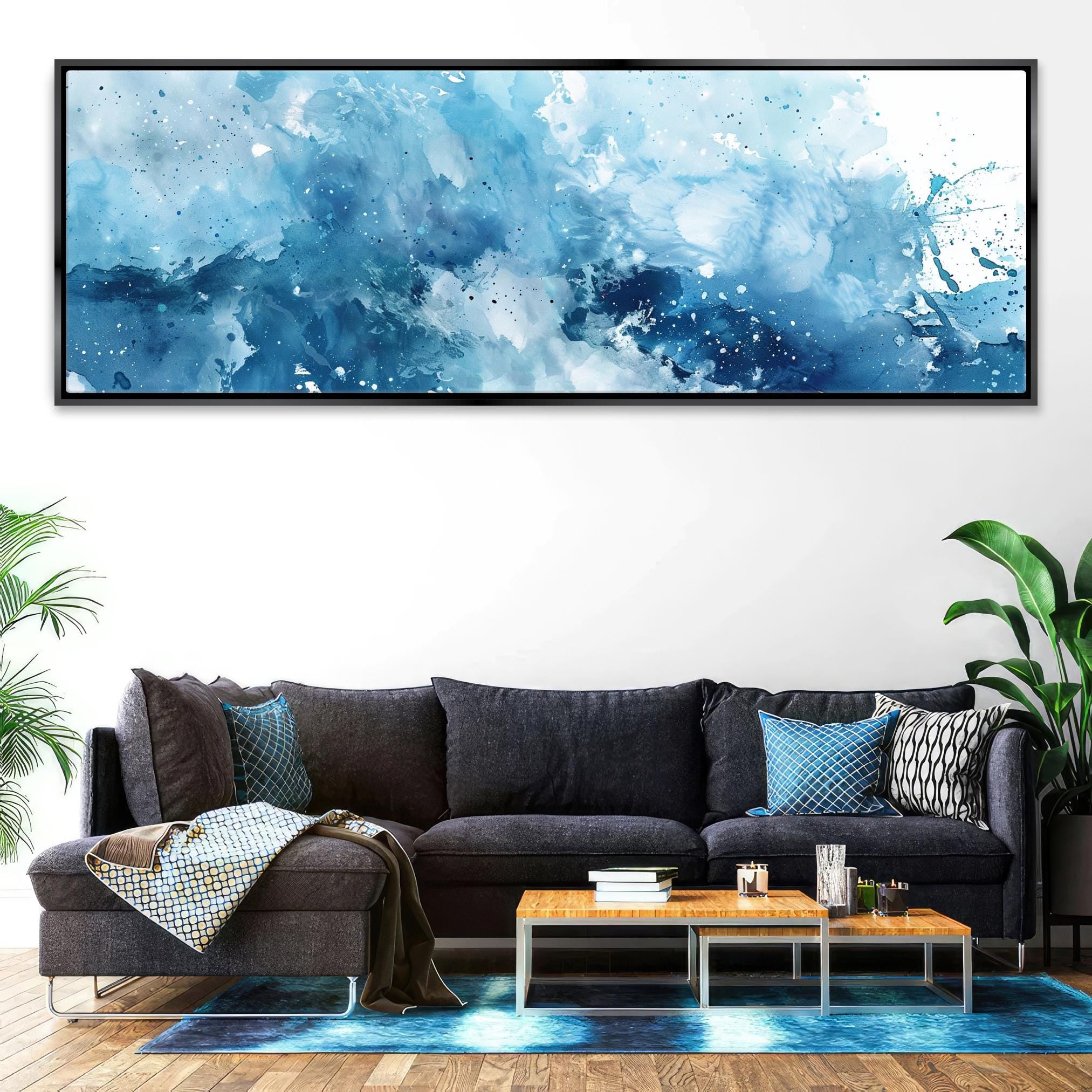 a living room with a couch and a painting on the wall
