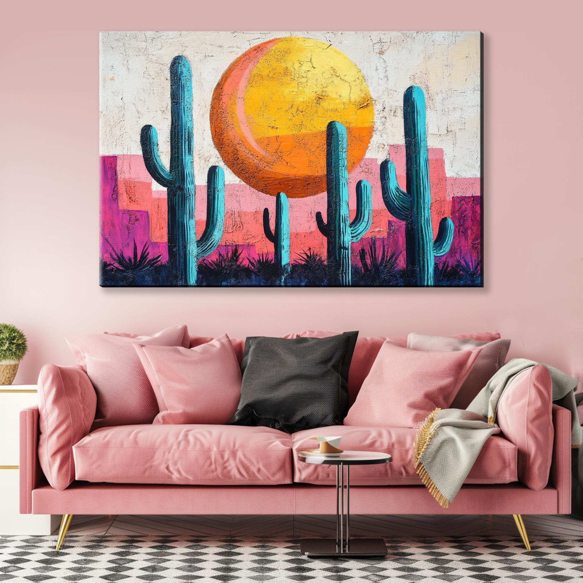a living room with a pink couch and a painting on the wall