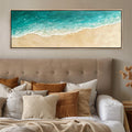 a bed with a large painting on the wall above it