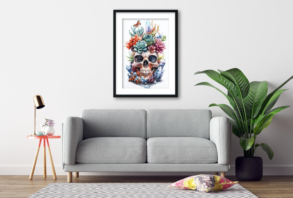 a gray sofa, a framed artwork of a skull with a colorful floral design, a small table with a lamp, and a potted plant, all set against a white wall.