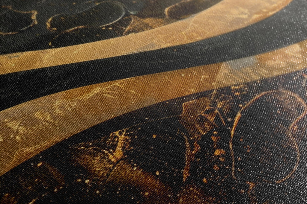 a close up of a black and gold painting