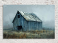 An old, dilapidated wooden barn stands alone in a foggy field, its weathered and worn appearance suggesting a long history of use and exposure to the elements.