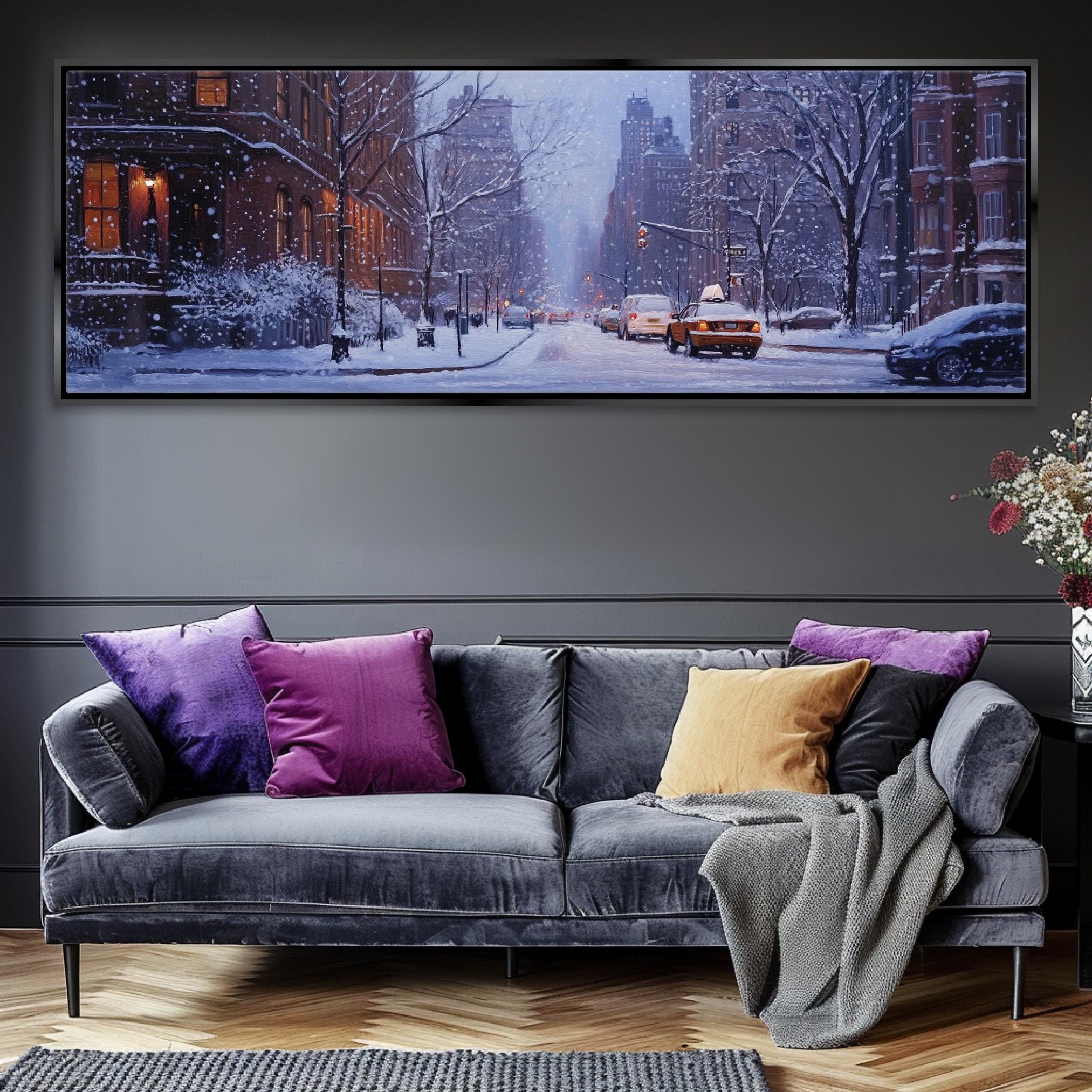 a living room with a couch and a painting on the wall