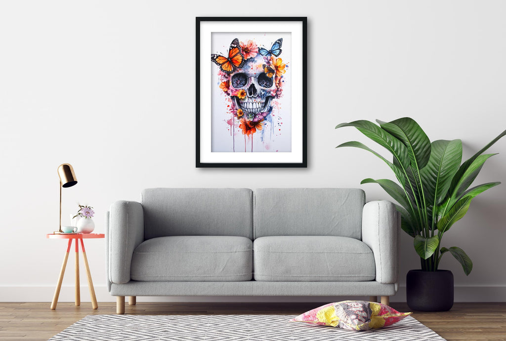 a gray sofa, a framed artwork of a skull with butterflies, a small table with a lamp, and a potted plant, all arranged in a living room setting.