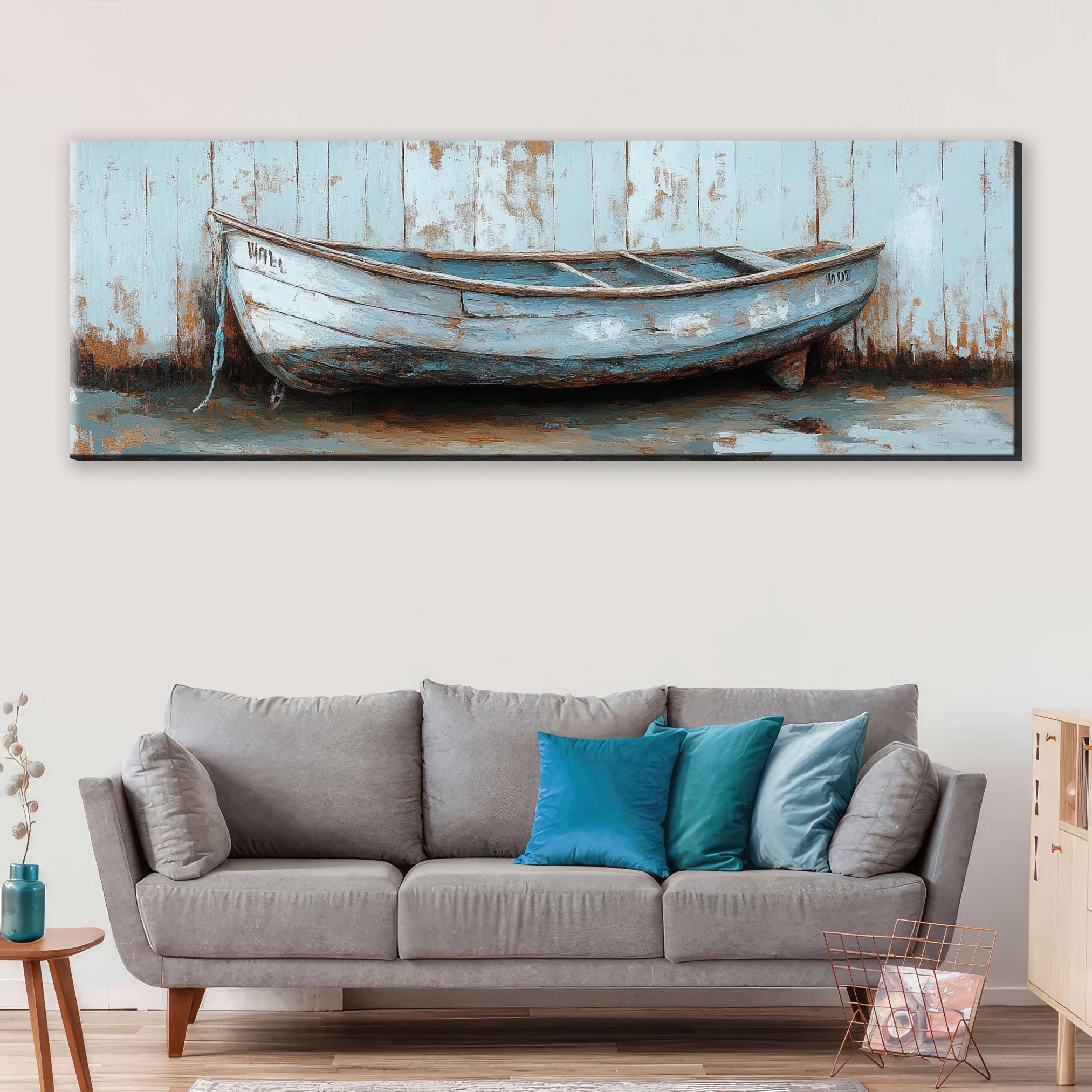 a painting of a boat on a wall above a couch