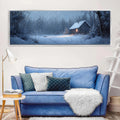 a living room with a blue couch and a painting on the wall