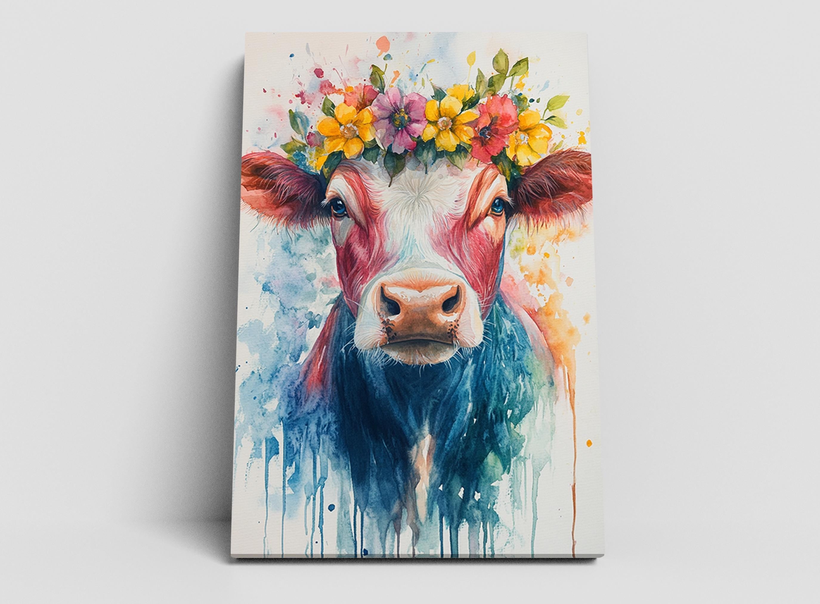 A colorful painting of a cow with a flower crown on its head, surrounded by splashes of watercolor paint.
