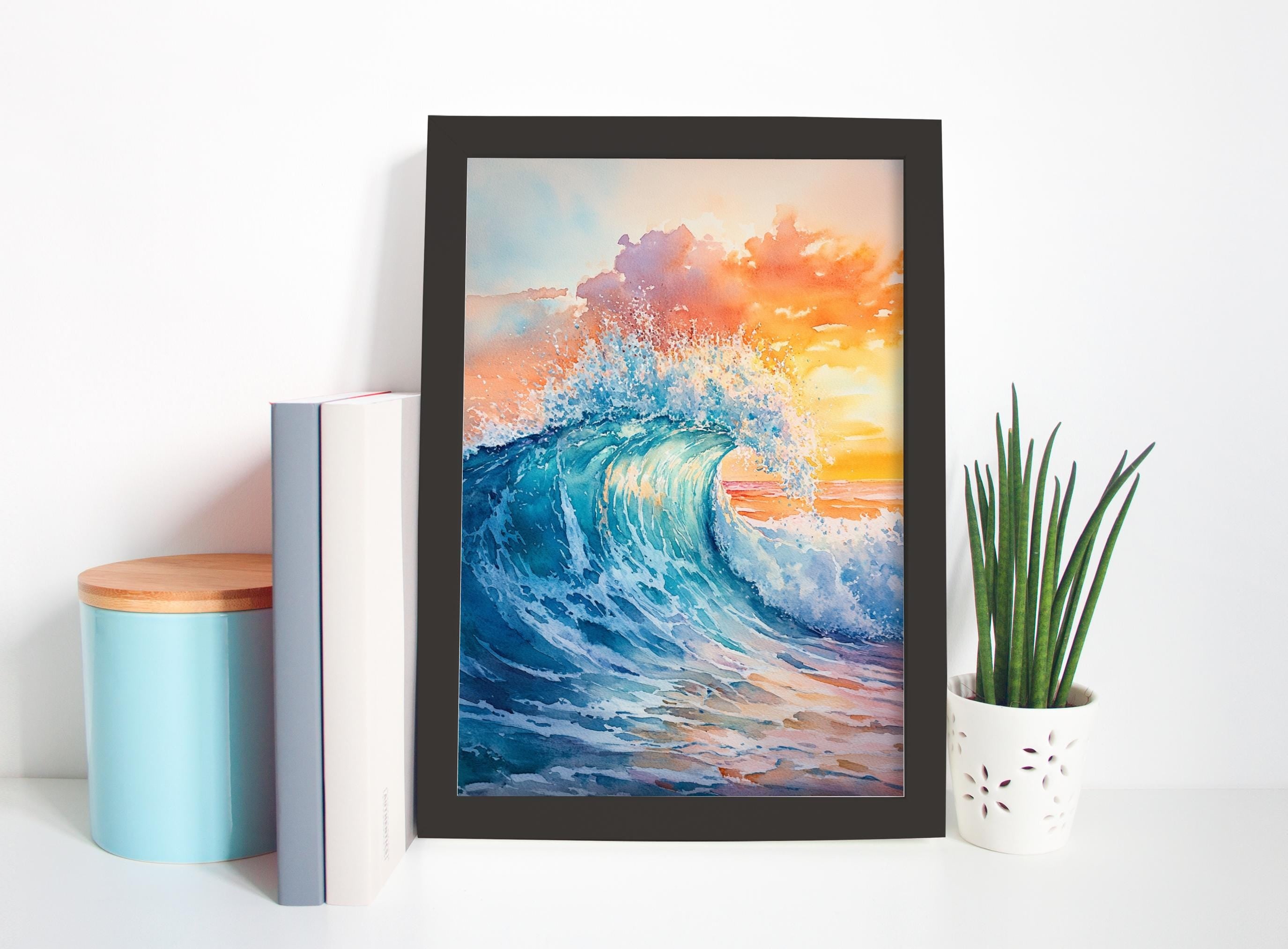 a framed painting of a large, crashing wave with a vibrant sunset in the background. The painting is displayed on a white wall, and there are a few other objects in the scene, including a blue container, a white pot with a plant, and a few books.