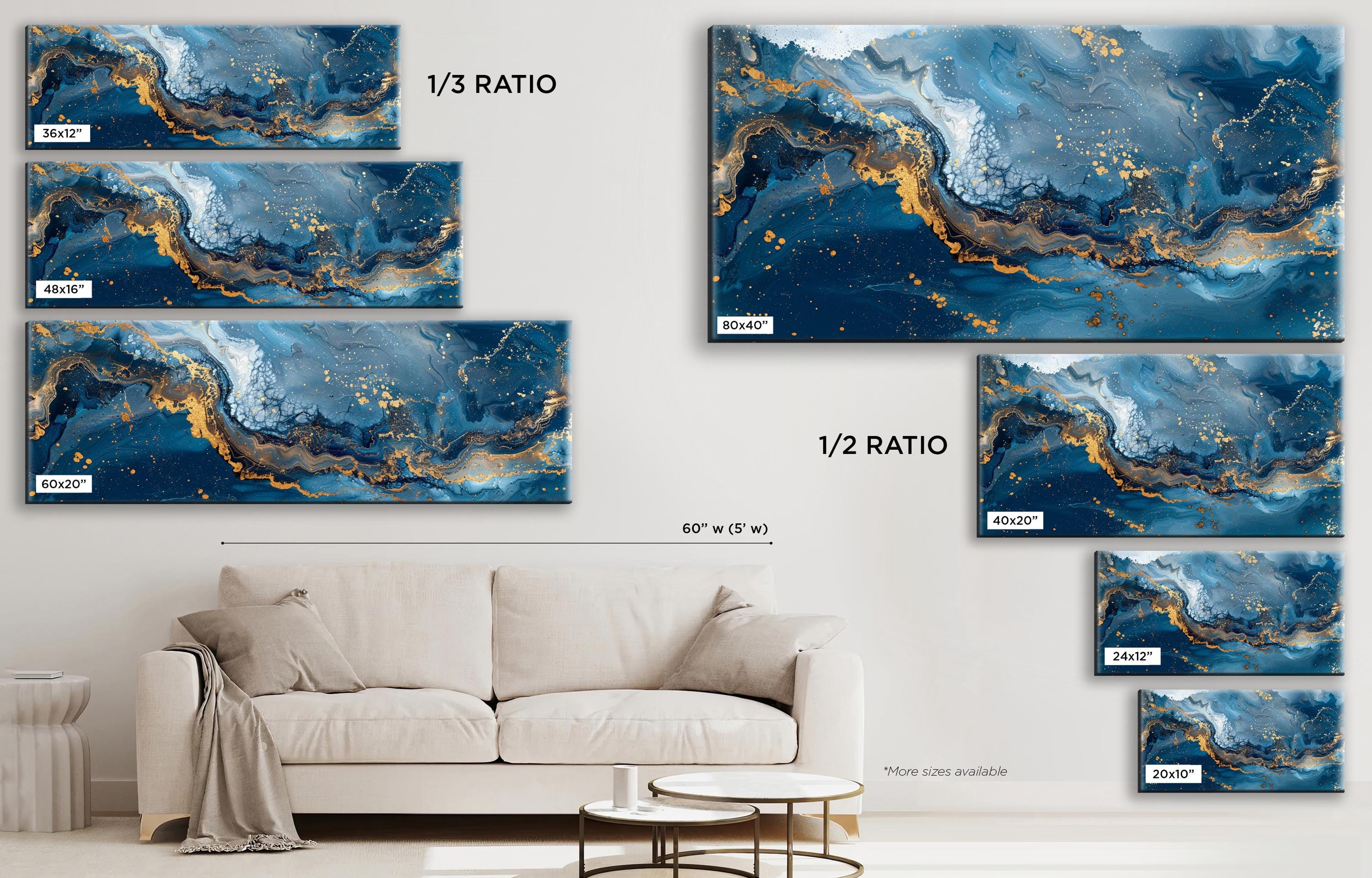 a living room with a couch and paintings on the wall