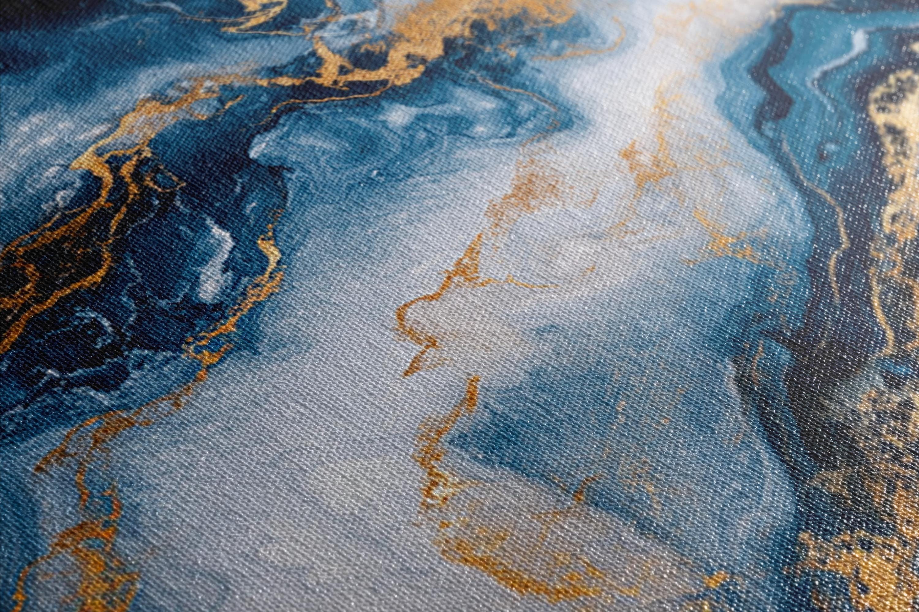a close up of a blue and gold painting