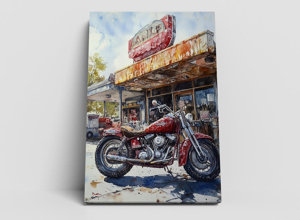 A red motorcycle parked in front of a dilapidated gas station with a faded sign.