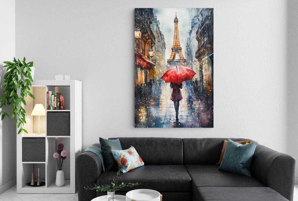 a cozy living room with a gray sectional sofa, a bookshelf, and a large painting of a rainy street scene with the Eiffel Tower in the background.