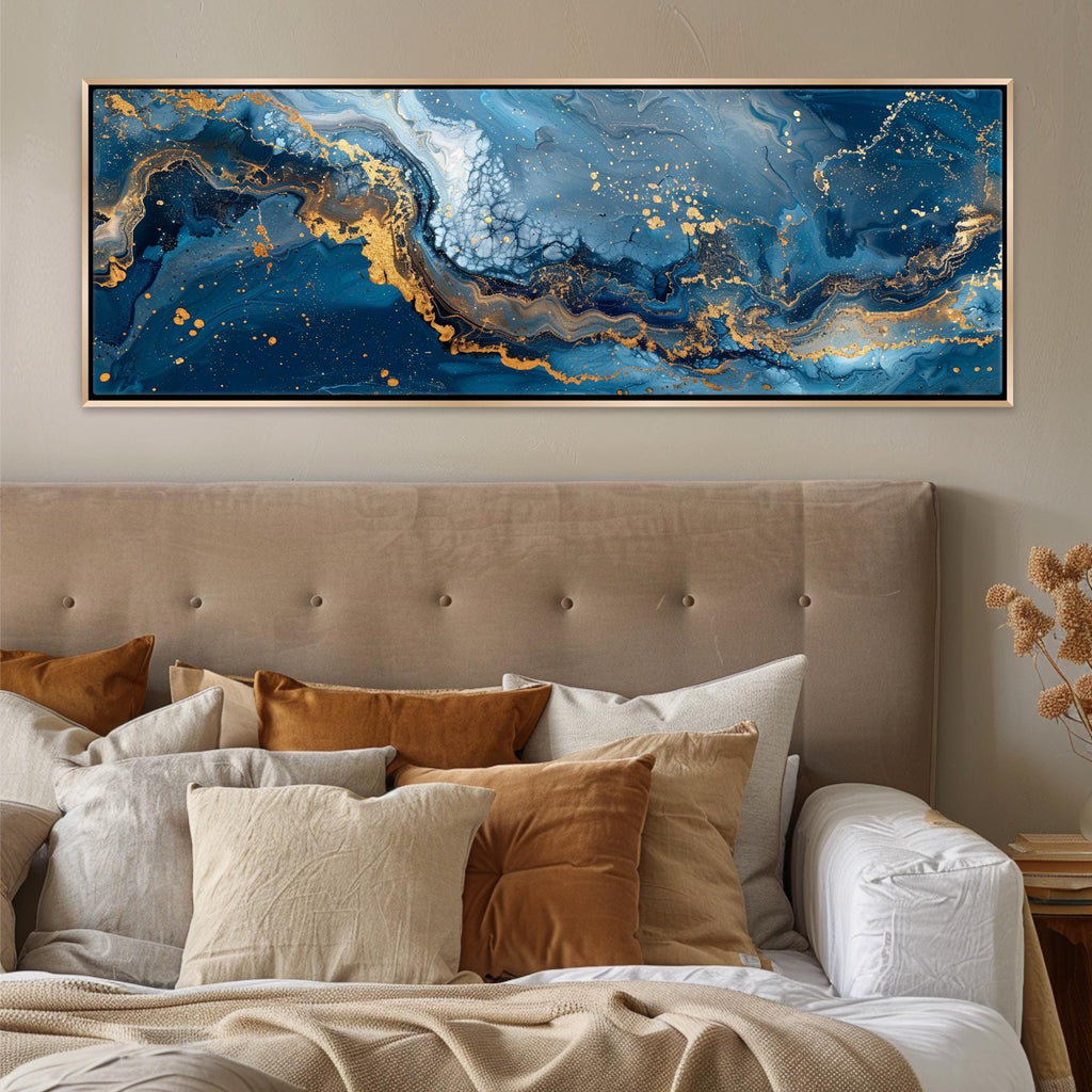 a bed with a large painting on the wall above it