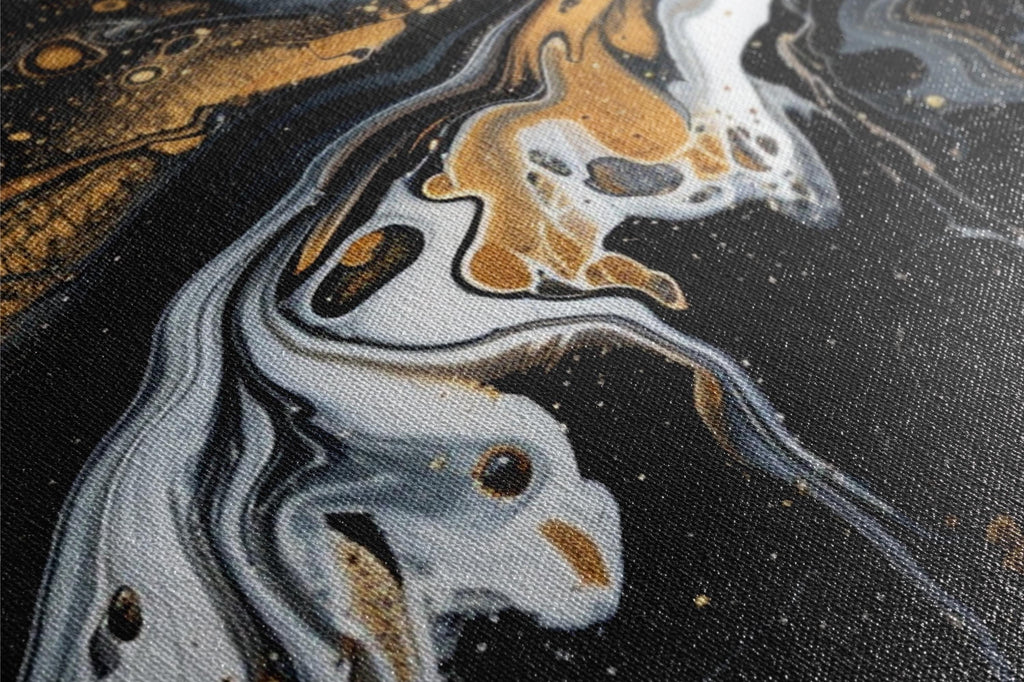 a close up of a black and gold painting