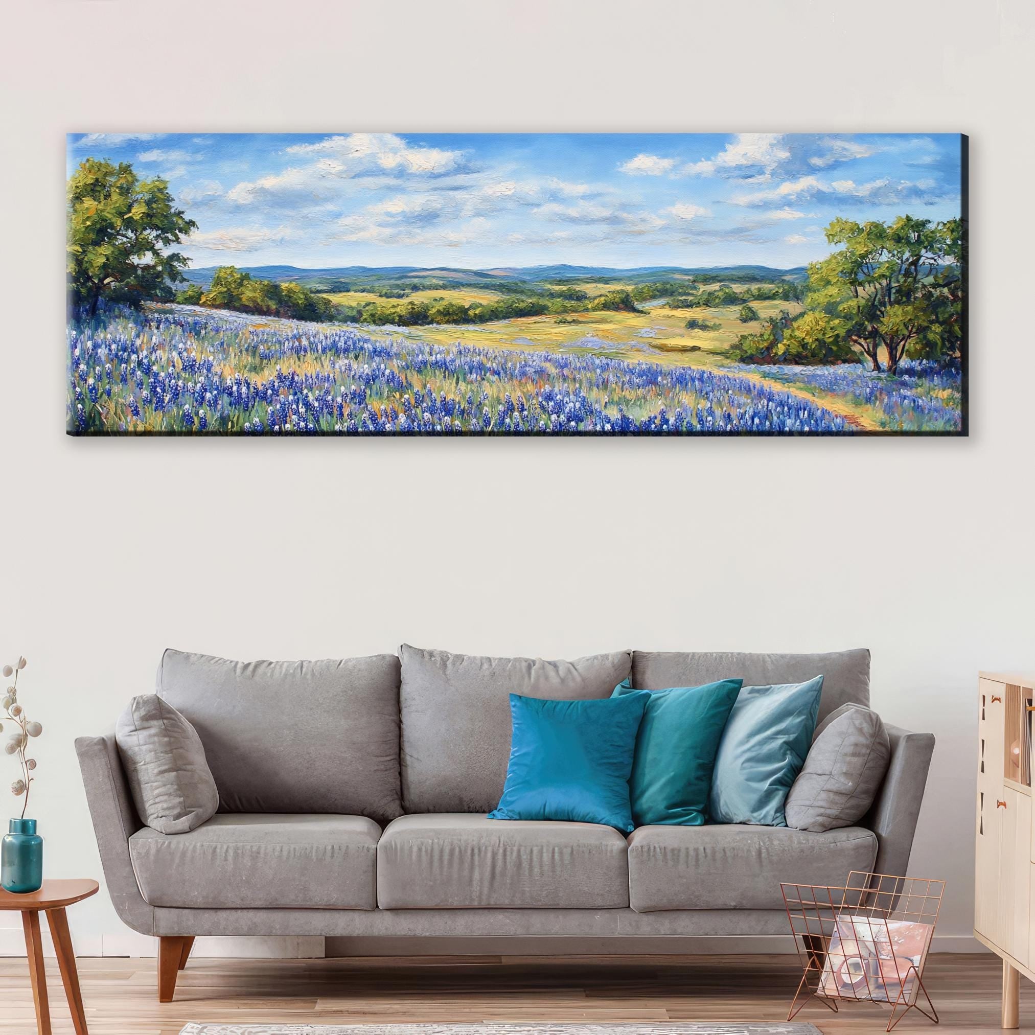 a living room with a couch and a painting on the wall
