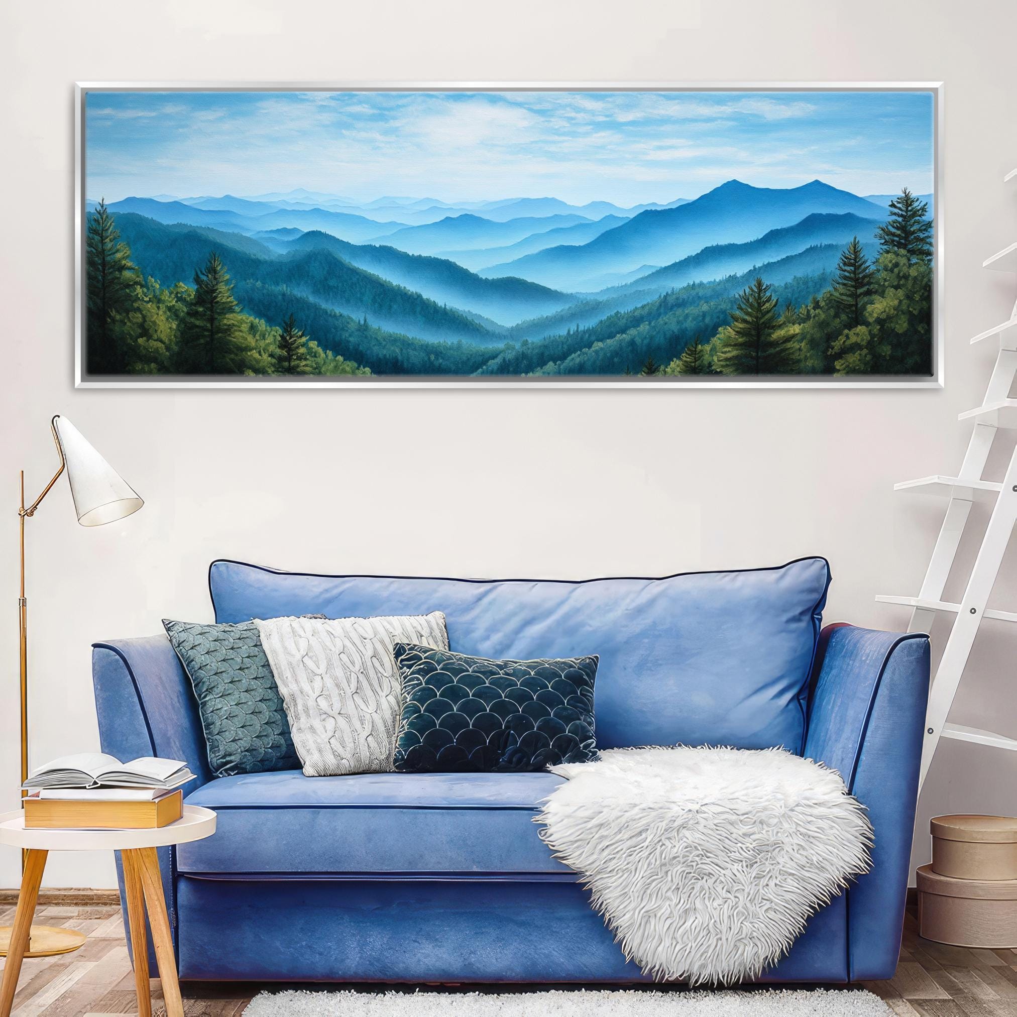 a living room with a blue couch and a painting on the wall