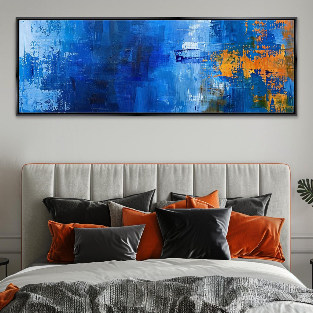 a large blue painting on a wall above a bed