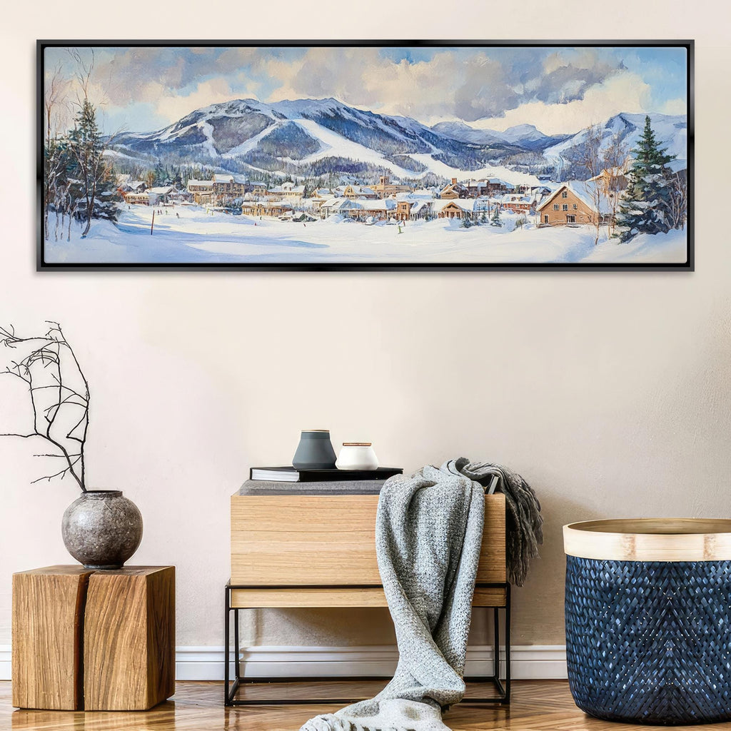 a painting of a snowy mountain town in a frame