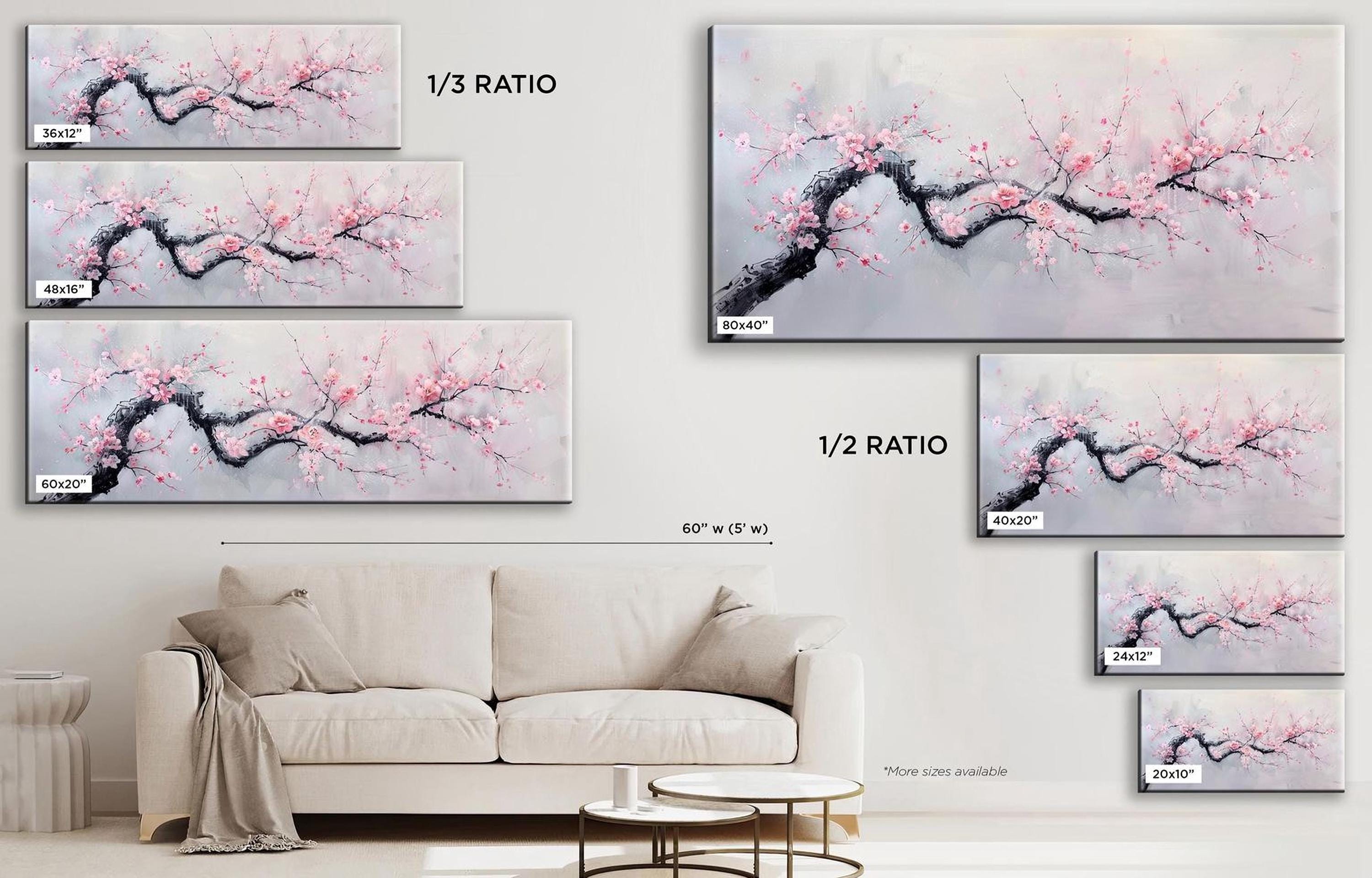 a living room with a white couch and paintings on the wall