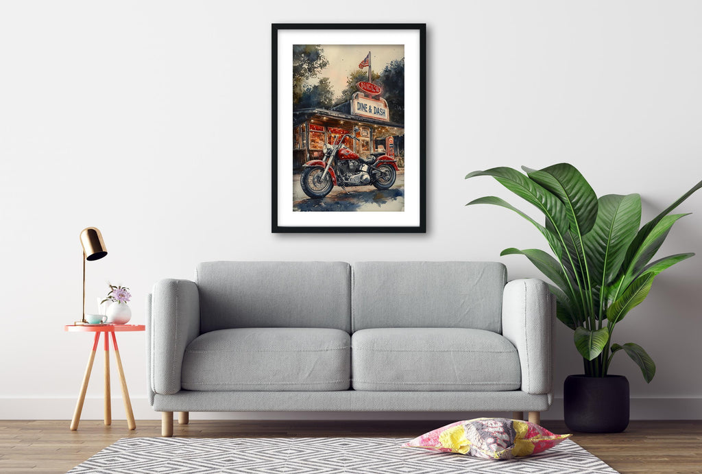a gray sofa, a framed painting of a motorcycle, a red table lamp, a potted plant, and a patterned rug on a wooden floor.