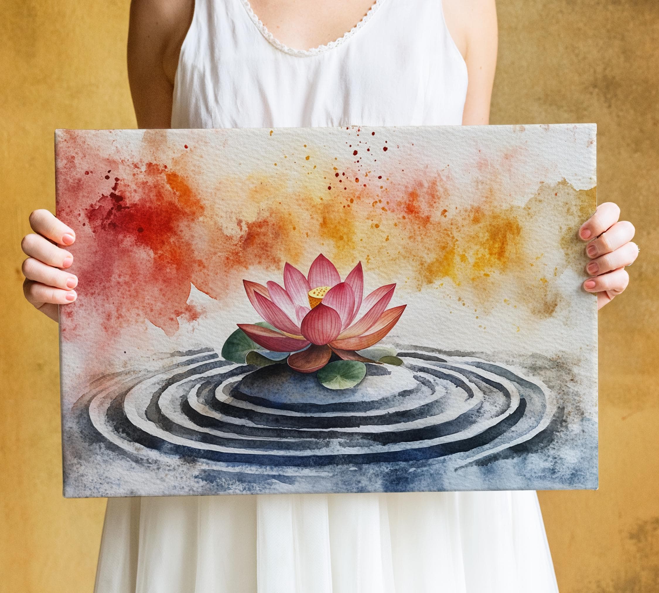A woman holds a watercolor painting depicting a lotus flower in a pond with concentric circles.