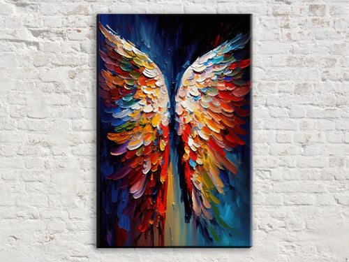 A vibrant, colorful painting of a pair of wings against a dark background, hanging on a white brick wall.