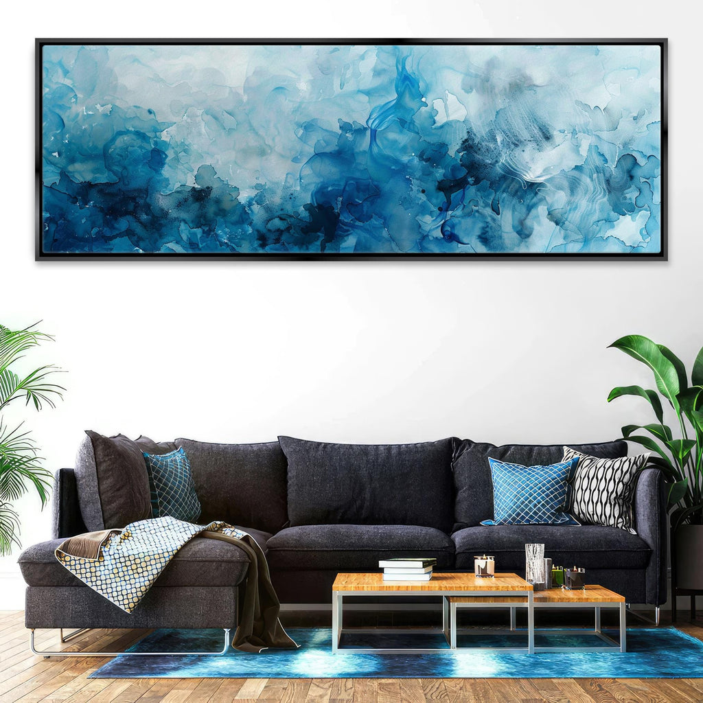 a living room with a couch and a painting on the wall