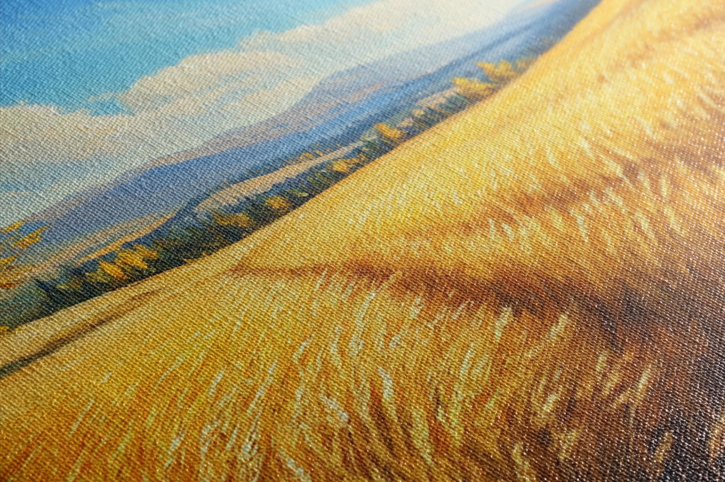 a serene landscape with a field of golden wheat stretching across the frame, set against a backdrop of mountains and a blue sky.