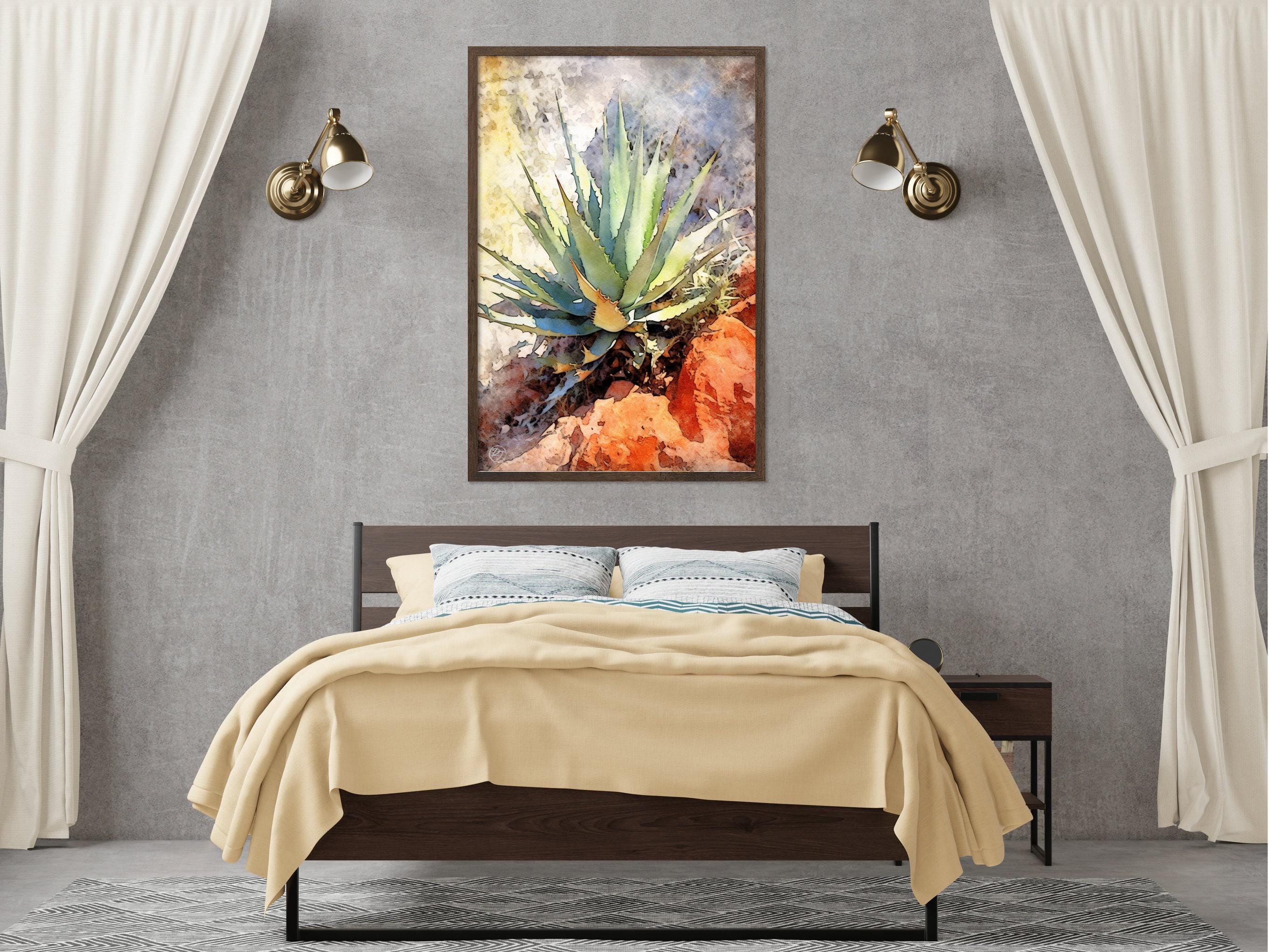 a bedroom with a bed, a nightstand, and a framed painting of a cactus plant hanging on the wall above the bed.