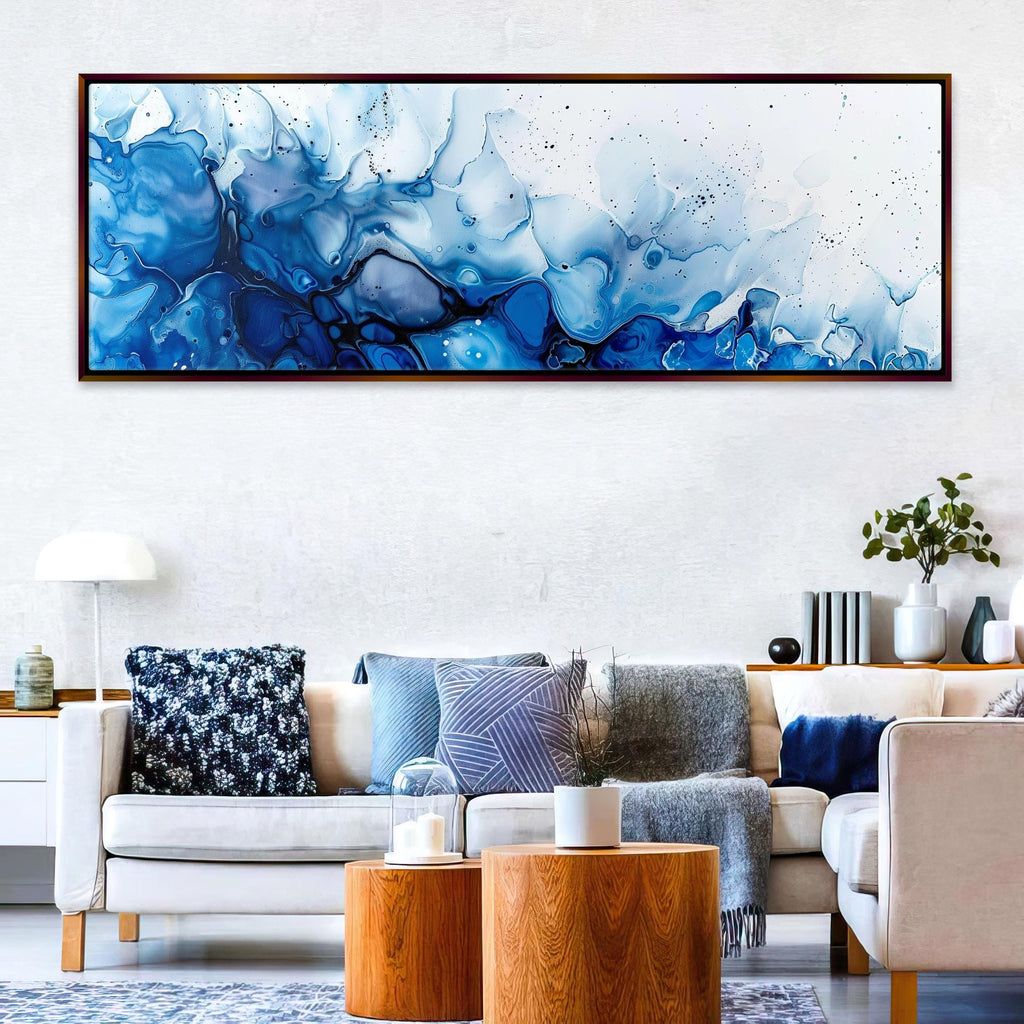 a living room filled with furniture and a painting on the wall