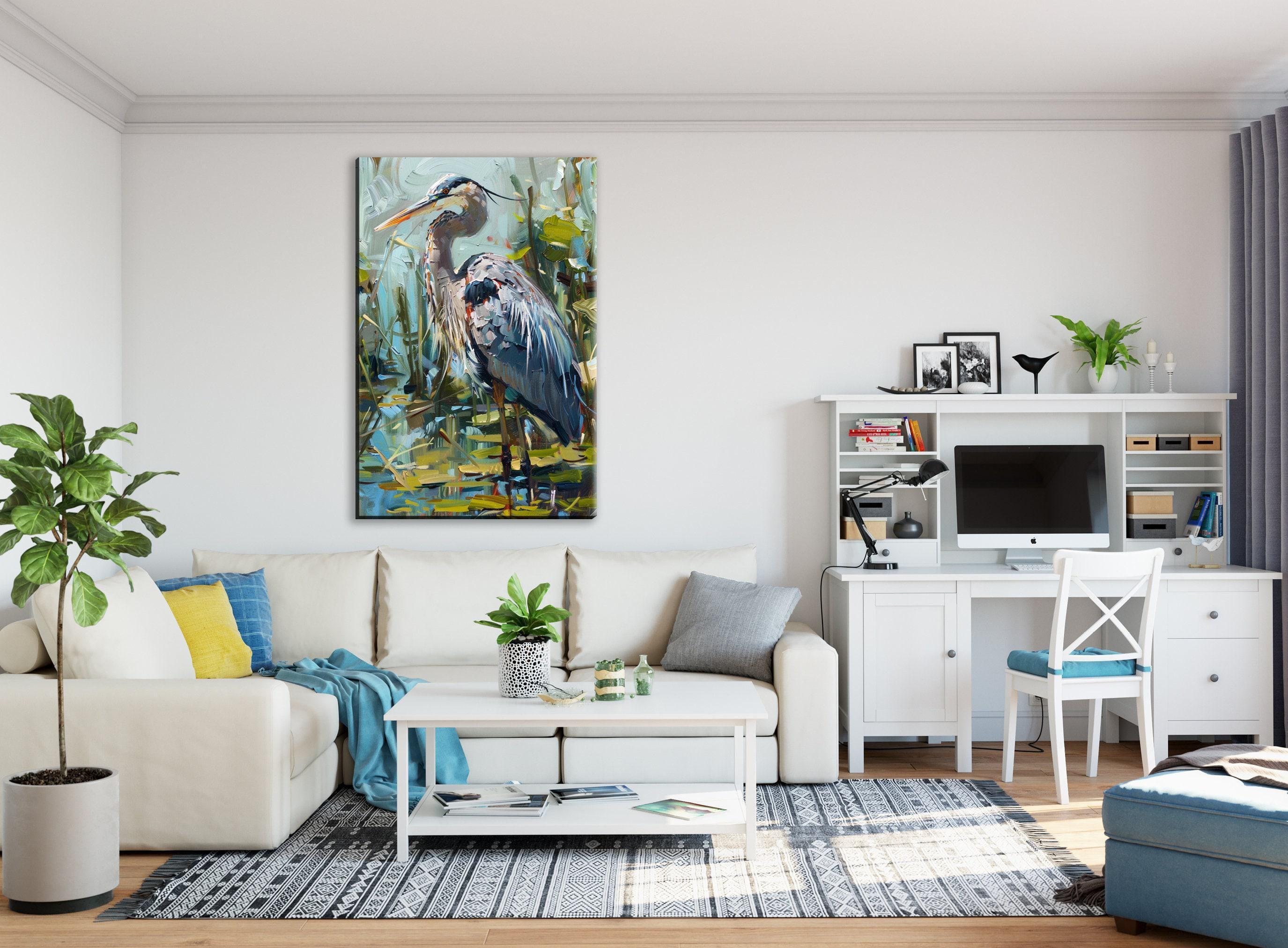 a modern living room with a large painting of a heron on the wall, a white sofa, a white coffee table, a white desk with a computer, and various decorative elements such as plants and books.