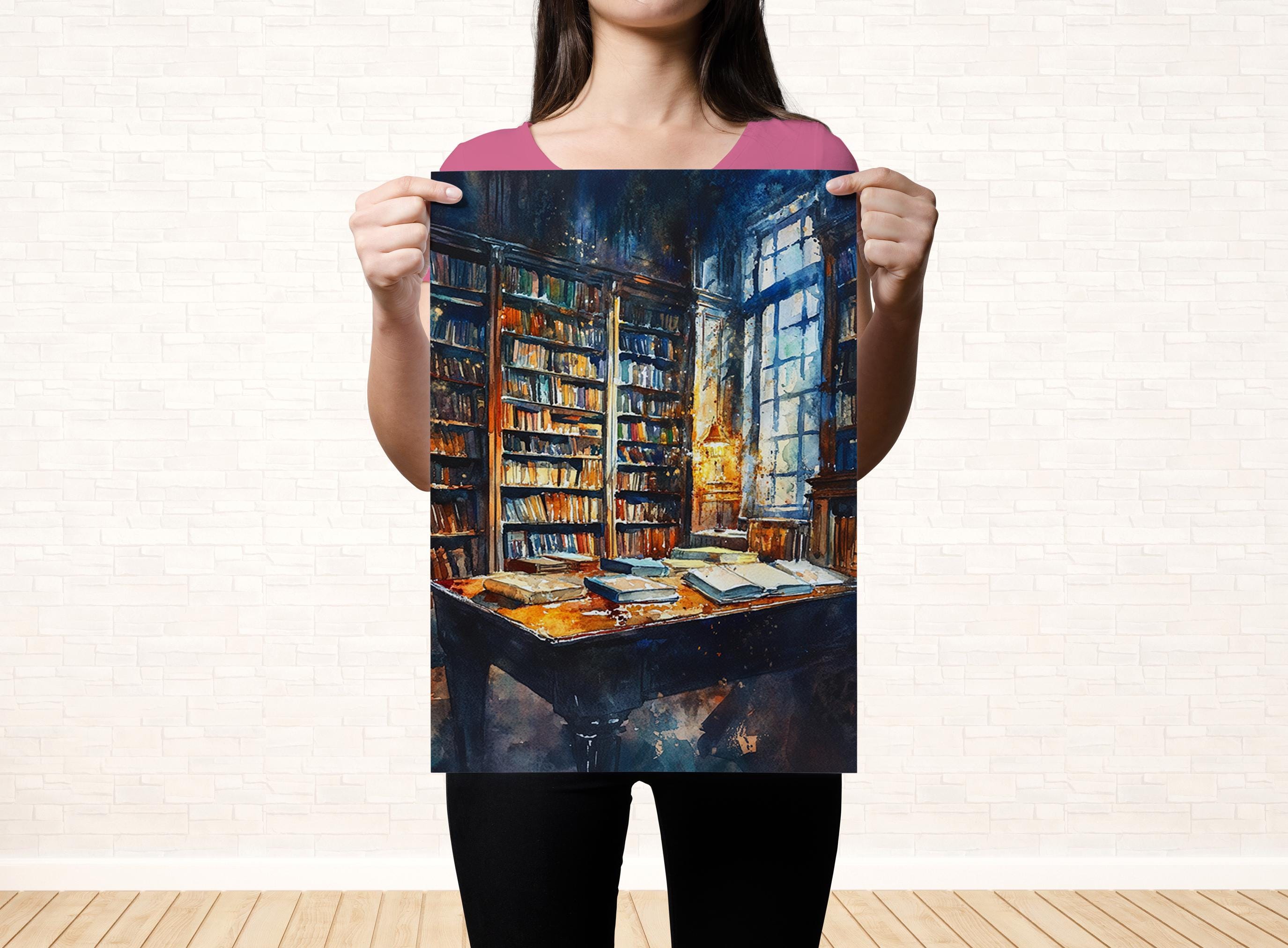 A woman holds up a framed painting depicting a cozy library scene with bookshelves, a desk, and a window.