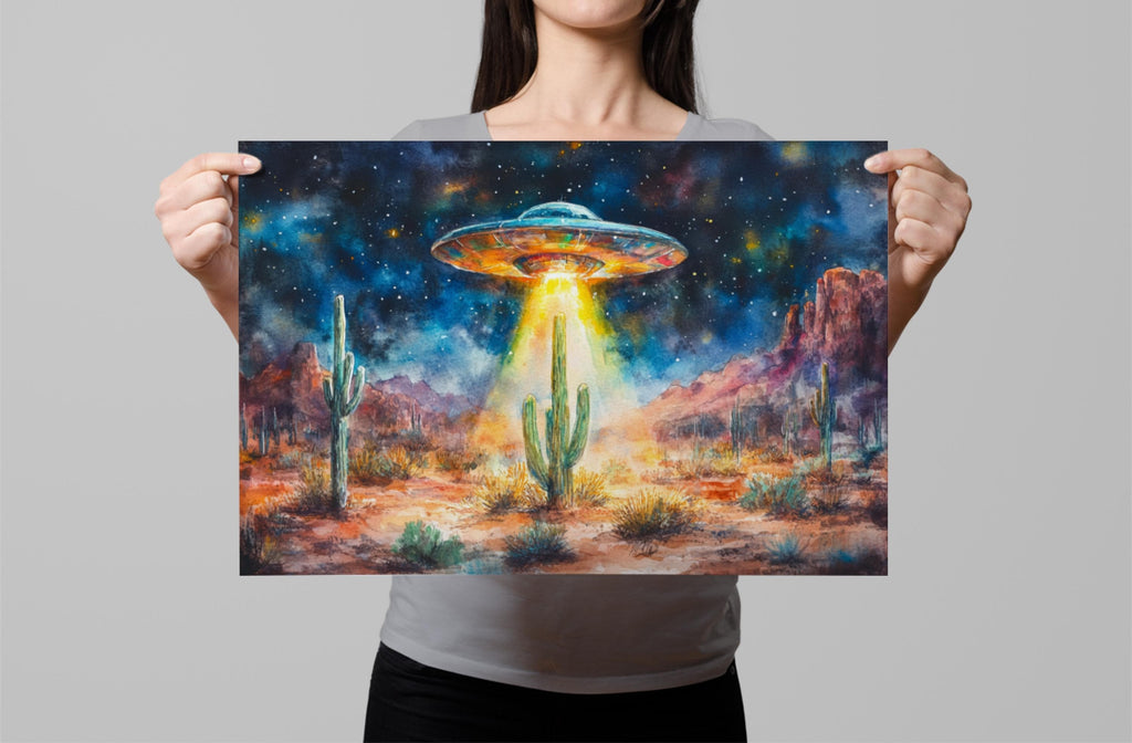 A woman holds up a painting depicting a desert landscape with a large alien spacecraft hovering above the cacti and mountains.