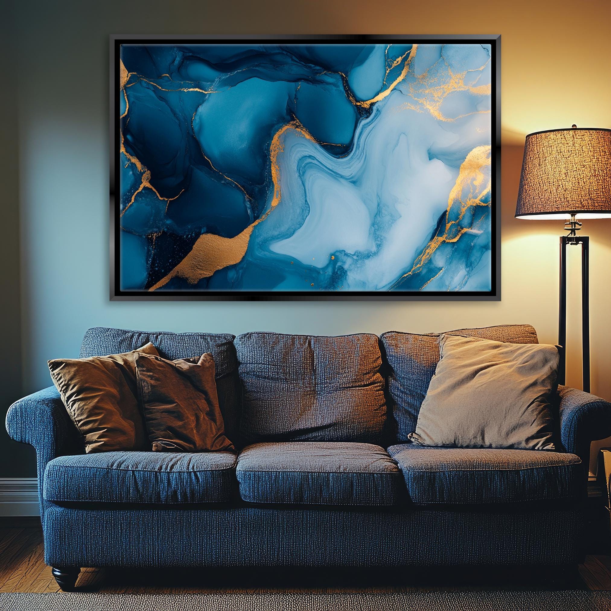 a living room with a couch and a painting on the wall