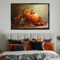 a large framed painting of a pumpkin and autumn leaves hanging above a bed with a gray headboard and black and orange pillows.