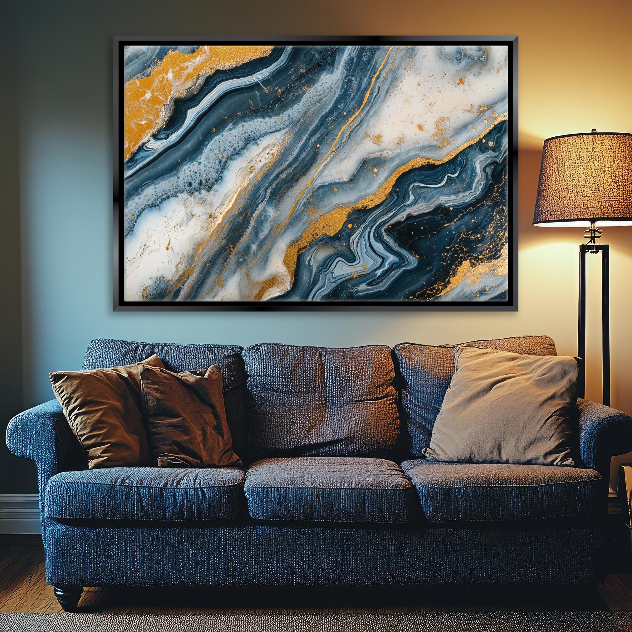 a living room with a couch and a painting on the wall