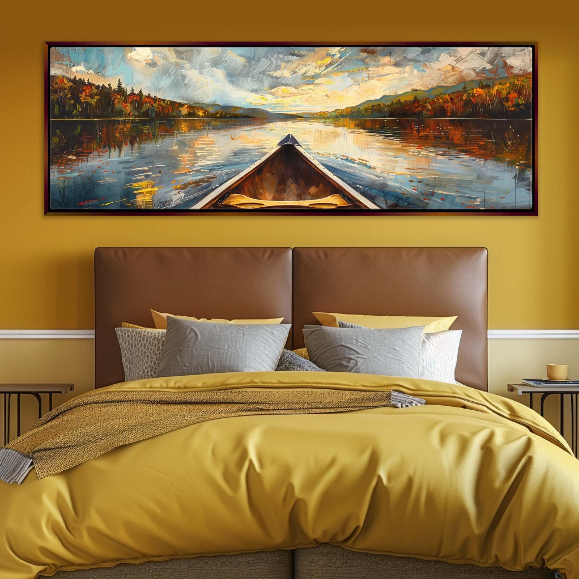 a large painting of a boat on a lake, hanging above a bed with yellow bedding.