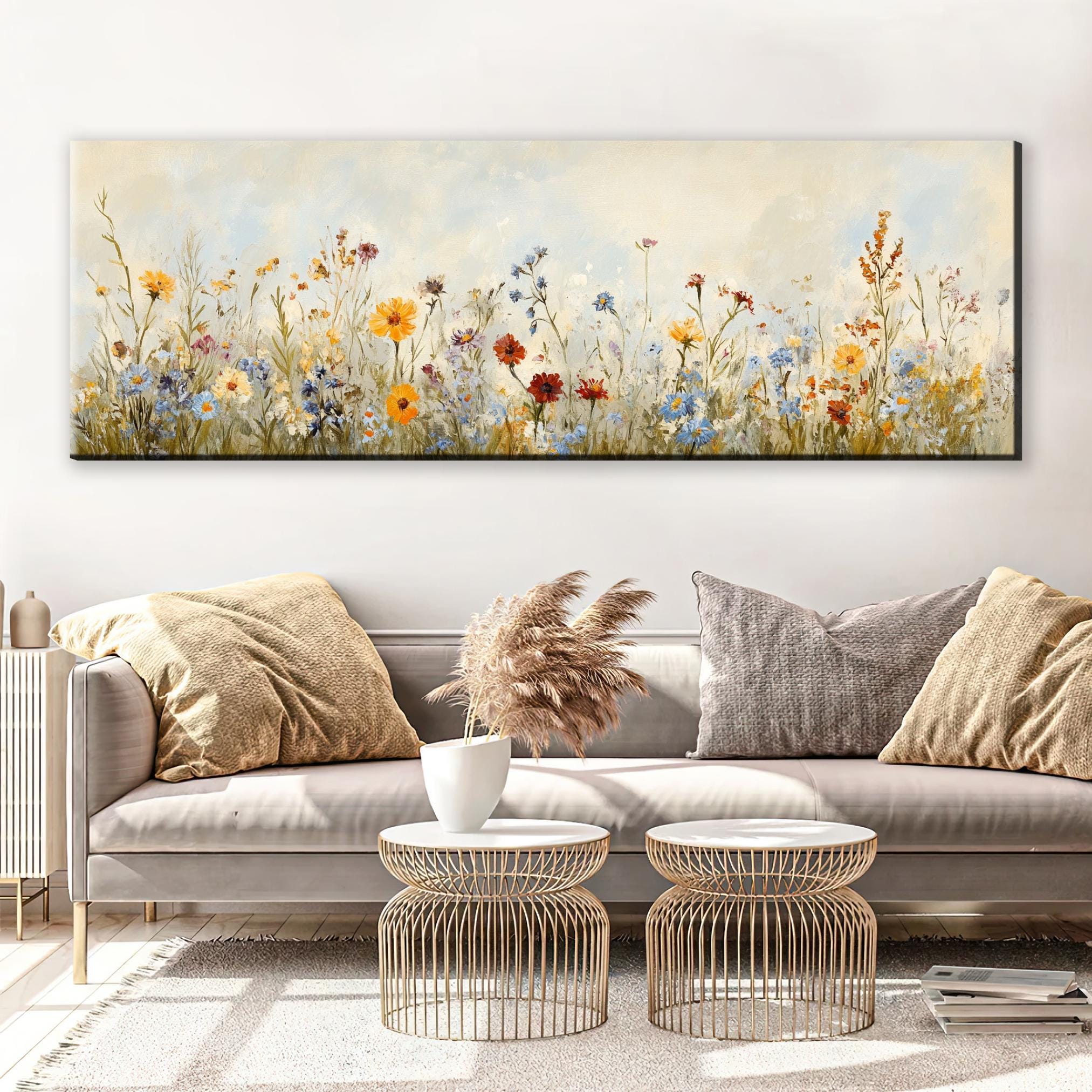 a living room with a couch and a painting on the wall