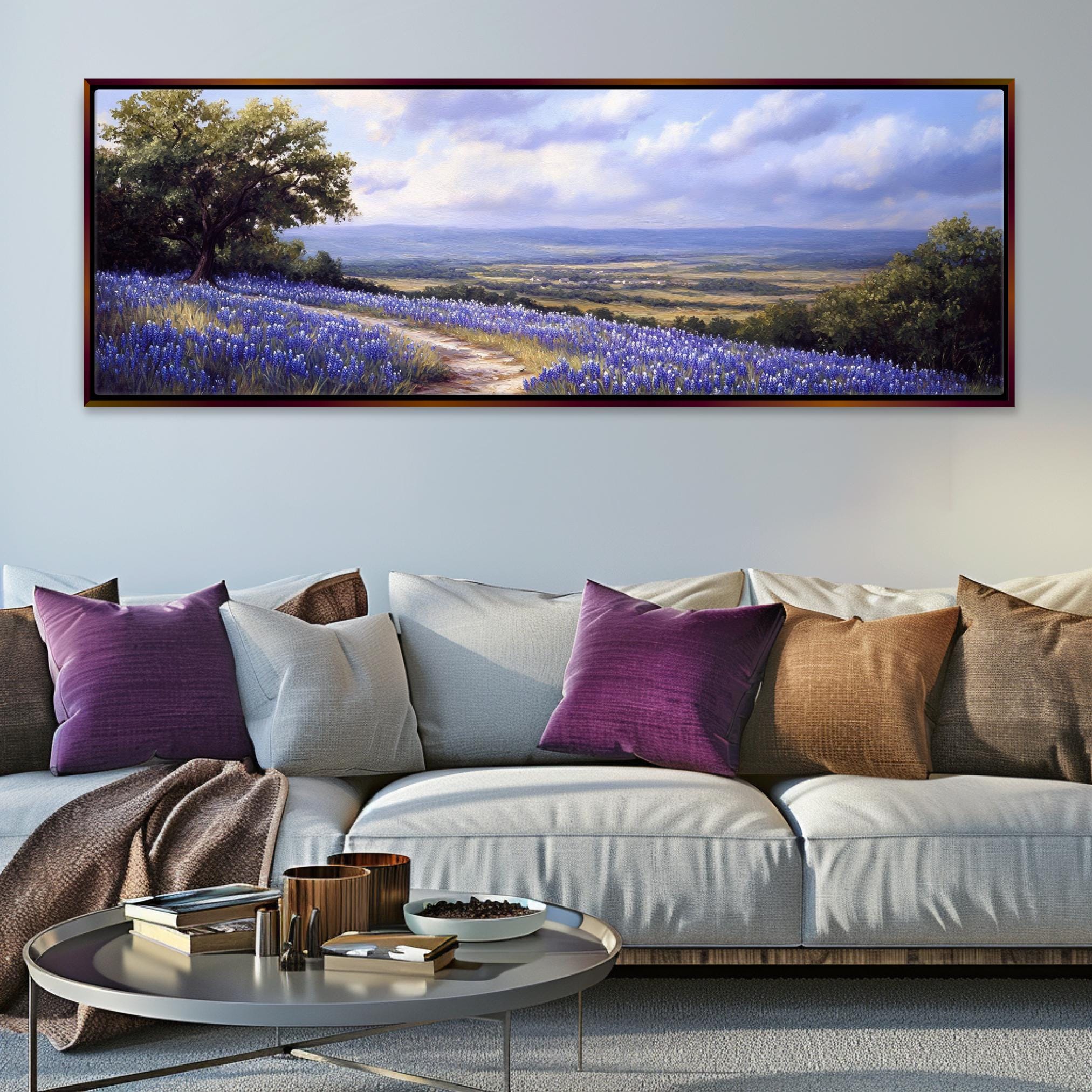 a living room with a couch and a painting on the wall