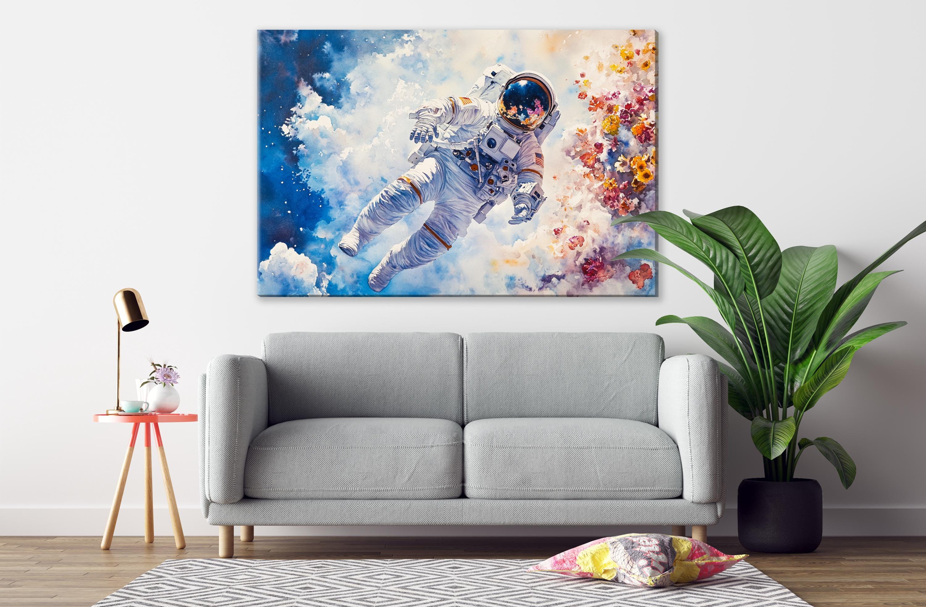 a gray sofa in a living room with a large painting of an astronaut floating in space above it.